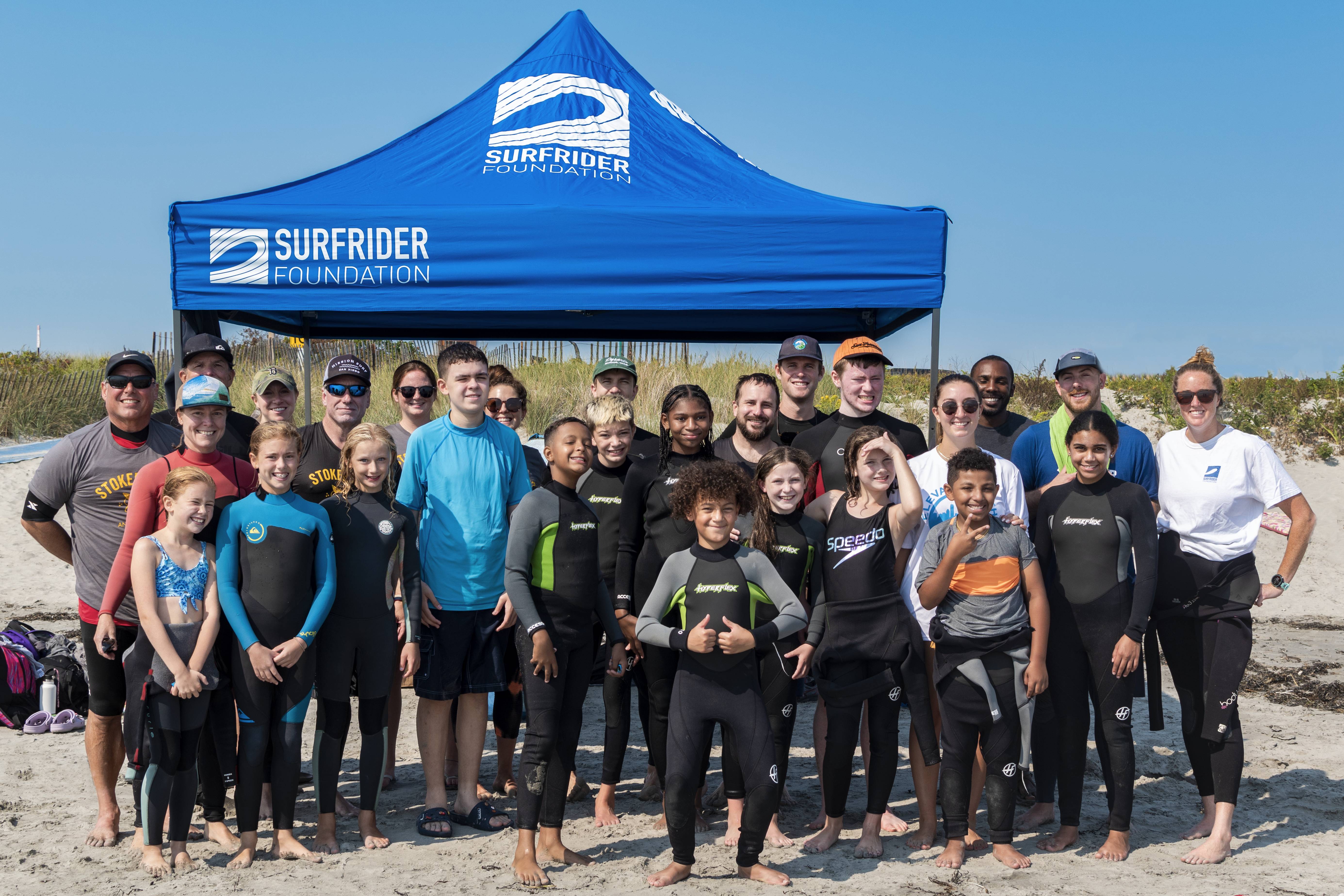 Group Photo in Front of Surfrider Tent